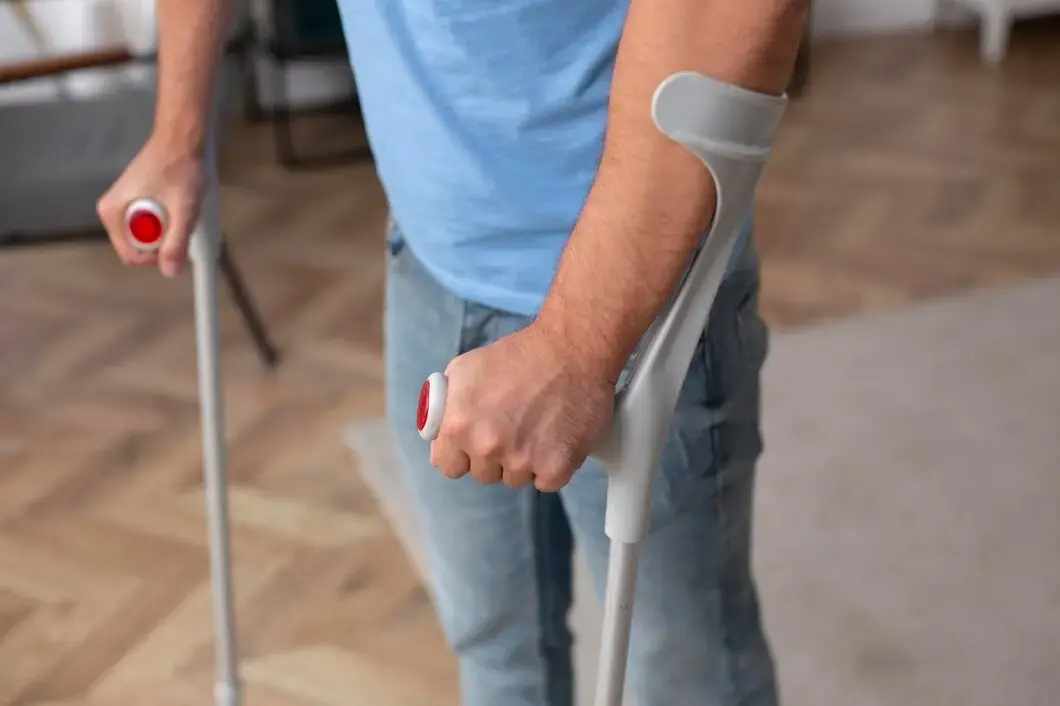 close-up-patient-walking-with-crutches
